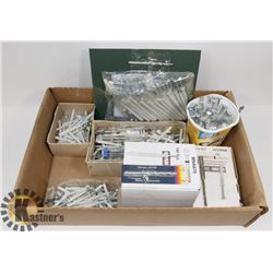 BOX OF CONCRETE PINS.