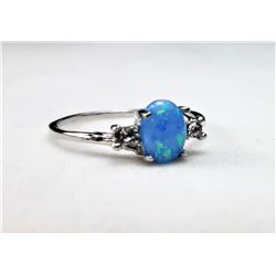 6)  PALE BLUE LAB CREATED FIRE OPAL