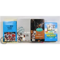 4 BOXES WITH UNOPENED PACKS OF ASSORTED