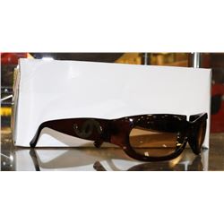 BOX OF SEE THROUGH BROWN DESIGNER SUNGLASSES.