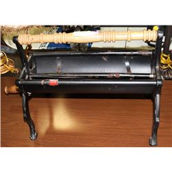 VINTAGE NEWSPAPER LOG ROLLER