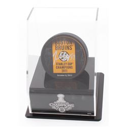 Patrice Bergeron Signed "2011 Stanley Cup Champions" Boston Bruins Logo Puck with Display Stand (Ber