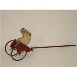 36 EARLY PAINT DECORATED HORSE 2 WHEEL PUSH TOY I