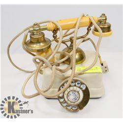 VINTAGE ROTARY PHONE WITH BRASS ACCENTS.