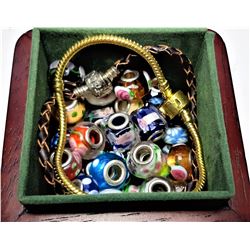 9)  WOODEN BOX CONTAINING 60 PANDORA