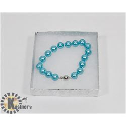 #50-SYNTHETIC SEA SHELL PEAR BRACELET  10MM