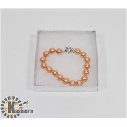 #47-SYNTHETIC SEA SHELL PEAR BRACELET  10MM