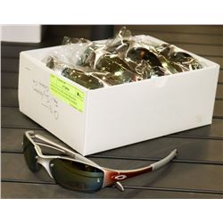 BOX OF SILVER AND ORANGE OAKLEY STYLED SUNGLASSES
