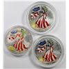 Image 1 : THREE COLORIZED AMERICAN SILVER EAGLES