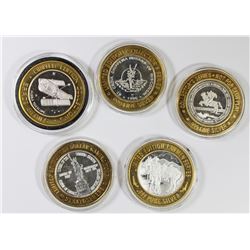 FIVE MISCELLANEOUS SILVER CASINO TOKENS