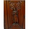 Image 2 : Walnut cupboard heavily carved with swag frieze and two medieval figures to the doors enclosing shel