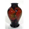 Image 1 : Moorcroft Pottery baluster vase, hand painted and tube lined with pomegranate pattern onto a dark bl