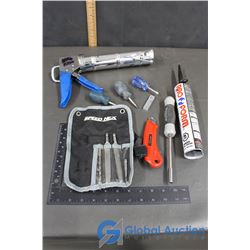 Caulking Gun with Black Pro Form Caulking, Misc Screwdrivers, Box Cutter, Drill Bit, Files