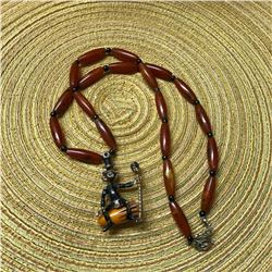 Wonderful Mid Century Bakelite African Voodoo Cannibal Man Figural Pendant Necklace