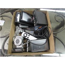 BOX OF GPS NAVIGATION SYSTEMS, CAMERAS, BLURAYS, COMPUTER COMPONENTS, APPLE TV REMOTE, SCALE, ETC