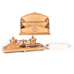 An ink stand and a desk set.