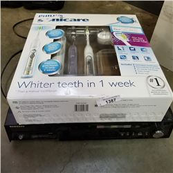 PHILLIPS SONICARE ELECTRIC TOOTHBRUSH AND SAMSUNG DVD HOME THEATER SYSTEM