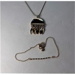 4)  GOLD TONE PENDANT WITH  ELONGATED