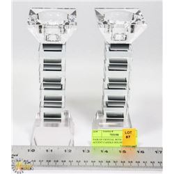 PAIR OF CRYSTAL WITH BLACK ACCENT CANDLE HOLDERS.