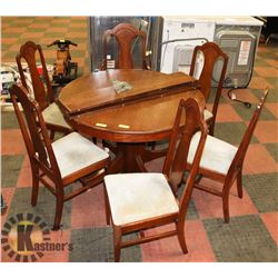 ROUND OAK TABLE WTH 3 LEAFS WITH 6 CHAIRS
