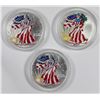 Image 1 : THREE COLORIZED AMERICAN SILVER EAGLES