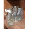 Image 4 : Lot of Various Sized Milk Bottles. 12 in Total. Most are Embossed Some are Painted Lables