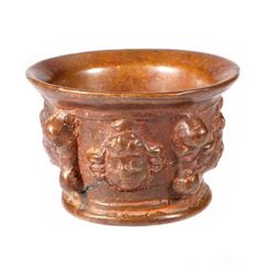 A cast bronze mortar.