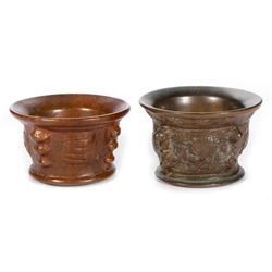 Two cast bronze mortars.