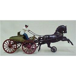 Horse drawn buggy with driver; cast iron; working