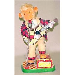 Monkey Playing Guitar; metal and plush battery op