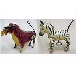 Two tin wind-ups; Ferdinand the Bull; and Zebra w