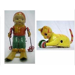Two tin wind-ups; Cat and Ball;( cat with cellulo