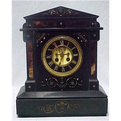 Slate cased mantle clock; open escapement; gilt o