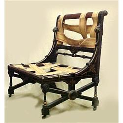 Ebonized Victorian settee; gilding over incised d