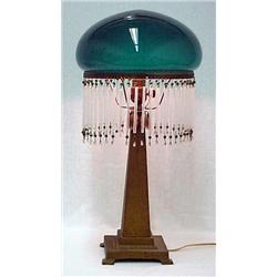 Metal lamp with green glass shade; gilt painted s