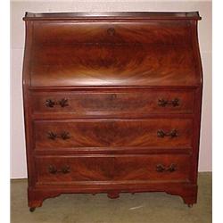 Slant front walnut desk; rectangular top with sma