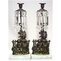 A pair of double figural girandoles; single candl