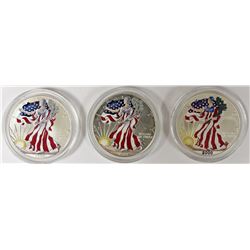 THREE COLORIZED AMERICAN SILVER EAGLES