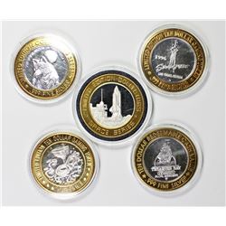 FIVE MISCELLANEOUS SILVER CASINO TOKENS