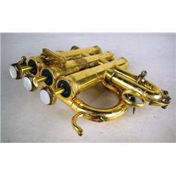 A SCHILKE CHICAGO USA (#7142) GOLD PLATED BRASS THREE PISTON VALVE TRUMPET Inscribed "DIZ", losses a