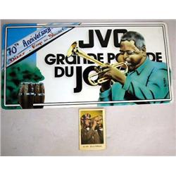 A DIZZY GILLESPIE CIGARETTE PACK TRADING CARD Some wear, together with a tin license plate sized pla