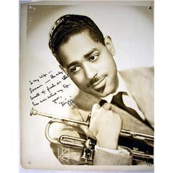 A BLACK AND WHITE PHOTOGRAPH OF DIZZY GILLESPIE H