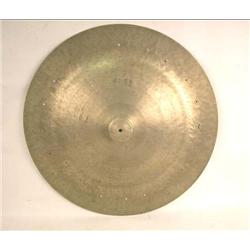 A LARGE BRASS CYMBAL WITHOUT STAND The top stamped "Made in Wyhan, China", wear and losses, 27" dia.