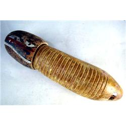 AN LP (LATIN PERCUSSION INC.) WOODEN GUIRO Together with a red, white and black painted piece, beari