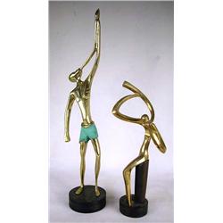 TWO STYLIZED BRASS FIGURAL SCULPTURES OF MUSICIANS Each on a wood base, some pitting and imperfectio