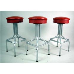 SIX TUBULAR METAL BAR STOOLS WITH ROUND RED FAUX LEATHER SEATS Wear throughout, 31 1/2"h x 14"d