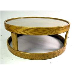 A CIRCULAR OAK DRUM TABLE WITH GLASS TOP Worn condition, 16"h x 41" dia.
