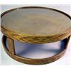 Image 2 : A CIRCULAR OAK DRUM TABLE WITH GLASS TOP Worn condition, 16"h x 41" dia.