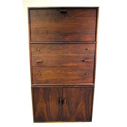 A WALNUT VENEERED MODULAR WALL UNIT With assorted cabinets and chest of drawers, heavy wear and loss
