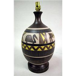 A POLYCHROME DECORATED CERAMIC TABLE LAMP 23"h